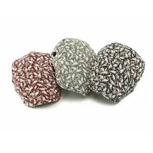 Ethnic berber-style beret hats in red, grey, and black with abstract leaf patterns