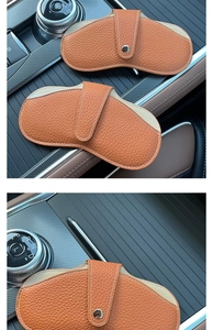 Litchi pattern leather car glasses bag in vibrant orange with snap closure detail