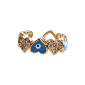Detail of gold evil eye heart ring with blue enamel inlay and micro zircon settings