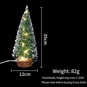 Detail view of 35cm lighted mini cedar tree with warm LED lights and wooden base