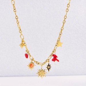 Detail of gold titanium steel necklace featuring sunflower and red heart pendants