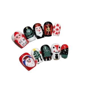 Christmas press-on nails set with red and green Santa Claus and snowflake art designs