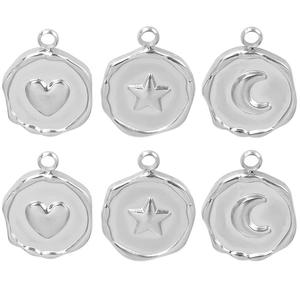 Detail showing polished silver heart, star, and moon charms with metal jump rings