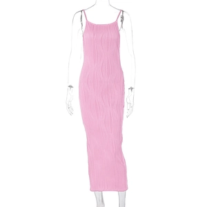 Detail of pink pleated maxi dress showing vertical wavy texture and thin straps