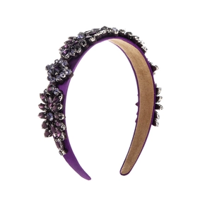 Detail of deep purple crystal flower clusters on a vintage velvet padded headband