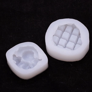 Silicone candle molds showing spiral texture and grid pattern for waffle and toast designs
