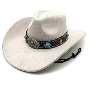 Detail of western cowboy hat with turquoise beads and silver bull head emblem on band