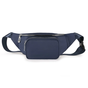 Detail of waterproof navy blue nylon waist bag showing multi-zipper layers and buckle strap