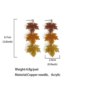 Acrylic maple leaf and pumpkin earrings with gold glitter finish and product dimensions