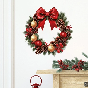 Christmas wall decal with red bows pine cones and festive balls on a white wall