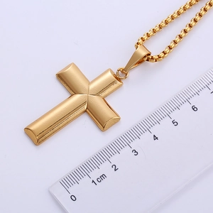 Detailed scale view of a flat 18k gold plated stainless steel cross pendant necklace