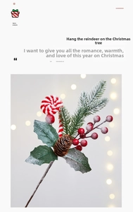 Detailed close-up of artificial pine branches with pinecones and red berry cluster
