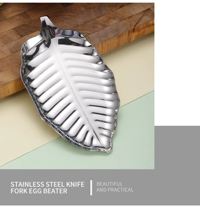 Detailed top view of silver leaf-shaped stainless steel tray with intricate vein textures