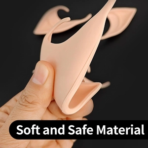 Close-up of soft latex elf ears in flesh tone demonstrating flexible material for cosplay