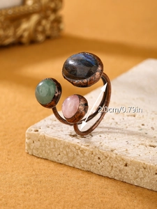 Detail of vintage adjustable ring featuring labradorite, rose quartz, and aventurine stones