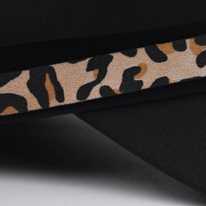 Classic black newsboy hat featuring a stylish leopard print chain strap and fabric texture