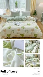 Detailed close-up of soft cotton duvet cover with green heart patterns and smile text