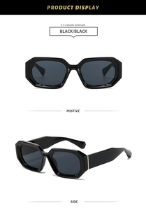 Detail of vintage square sunglasses featuring thick frames and golden side accents