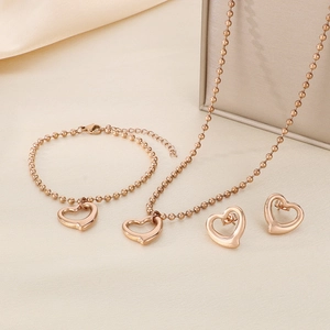 Parure de bijoux en or rose avec pendentif cœur, collier, bracelet et boucles d'oreilles