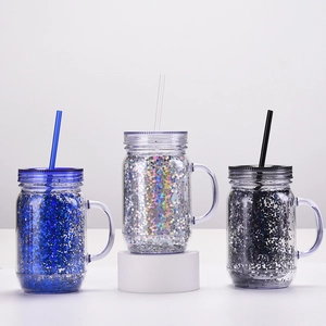 Three double-wall glitter plastic mason jars with handles and straws in blue silver black