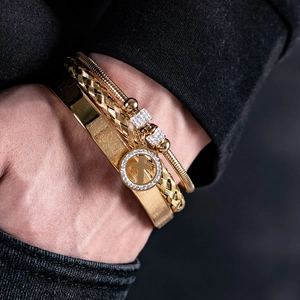 Three-piece gold stainless steel layered bracelet set with crystal cross charm