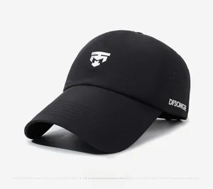 Close-up of black breathable baseball cap with laser-cut side vents and silver logo