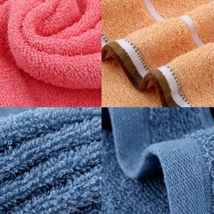 Macro detail of high-density cotton towel loops and reinforced hemmed edges