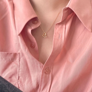 Elegant 925 sterling silver heart pendant necklace in gold finish worn by model