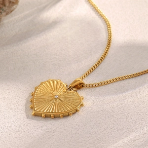 18K gold plated stainless steel heart necklace with radiant texture and small diamond