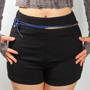 Detail of blue woven rope belt featuring gold metal tube accents on a female model
