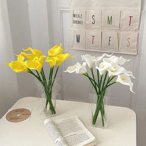 Elegant white and yellow PU calla lilies in minimalist acrylic vases for home decoration