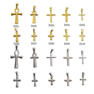Assorted gold and silver stainless steel cross pendants in a 10-piece grid display