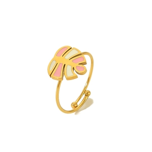 Macro view of adjustable monstera leaf ring with pink and beige enamel on gold steel