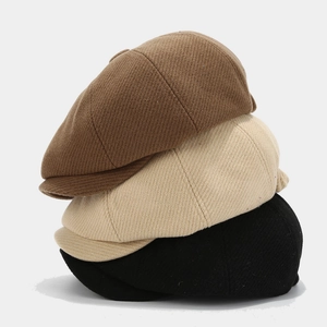 Octagonal newsboy hats in black, beige, and coffee colors with twill wool texture