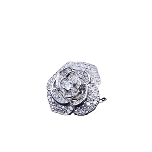 Silver flower ring with sparkling crystals and a central diamond on a clean white background
