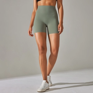 Close-up of sage green high-waisted yoga shorts with smooth matte moisture-wicking fabric