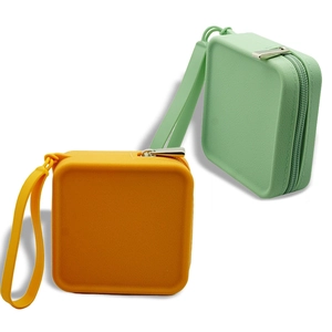 Minimalist square silicone pouches in yellow and green with zippers and wrist straps