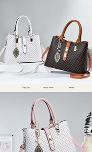 Detail showing high-quality leather texture and metallic lock on stylish tote bag