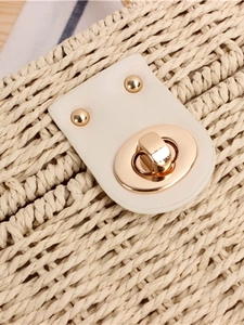 Elegant woven box bag with white leather flap and gold twist lock closure for women