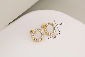 Detail of 13mm gold stainless steel hoop earrings with sparkling crystal stones