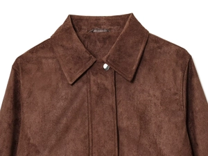Detailed close-up of brown faux suede jacket collar with silver metal snap button