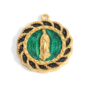 Macro shot of gold-plated Virgin Mary pendant with green enamel and cross detail