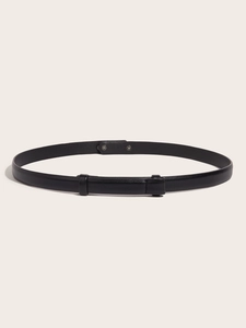 Detailed close-up of a slim black leather waist belt with adjustable metal buckle on white background