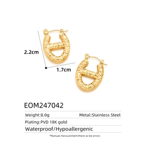 Detailed view of hammered 18K gold plated stainless steel oval link earrings with measurements