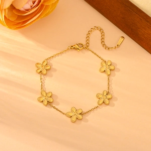 Bracelet chaîne marguerite en acier inoxydable doré avec charms floraux et fermoir