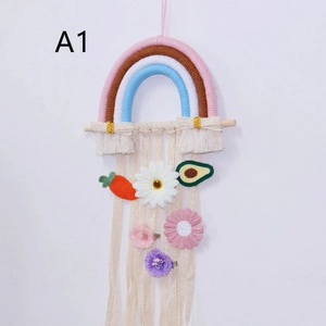 Close-up of rainbow woven wall hanging storage with colorful flower and fruit hair clips