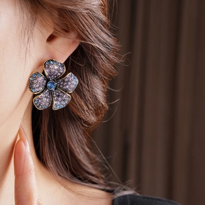Vintage flower earrings with purple and blue crystals in a luxury bronze setting