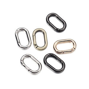 Macro detail of oval spring carabiners in various metal finishes for bags and DIY crafts