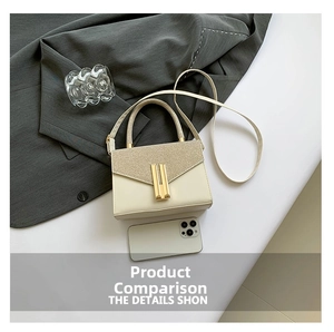 Mini cream crossbody bag with gold metal clasp shown next to phone for size reference