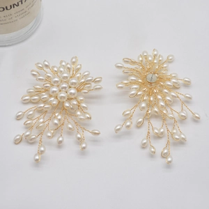 Elegant handmade pearl flower tassel earrings with golden wire floral spray design